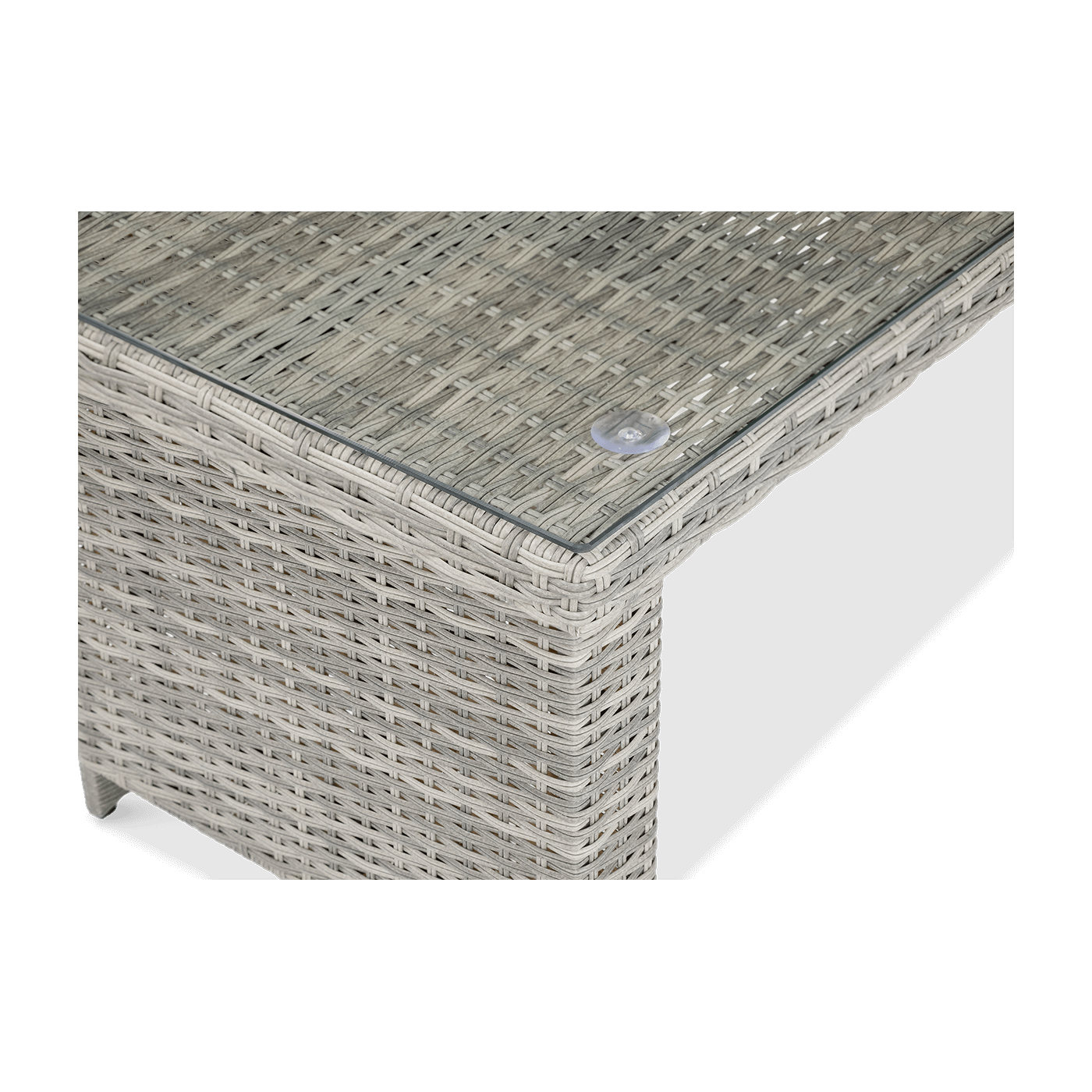 Zbliżenie na stół przykryty hartowanym szkłem zestawu technorattanowego MONIZ DINING PLUS Stone Grey