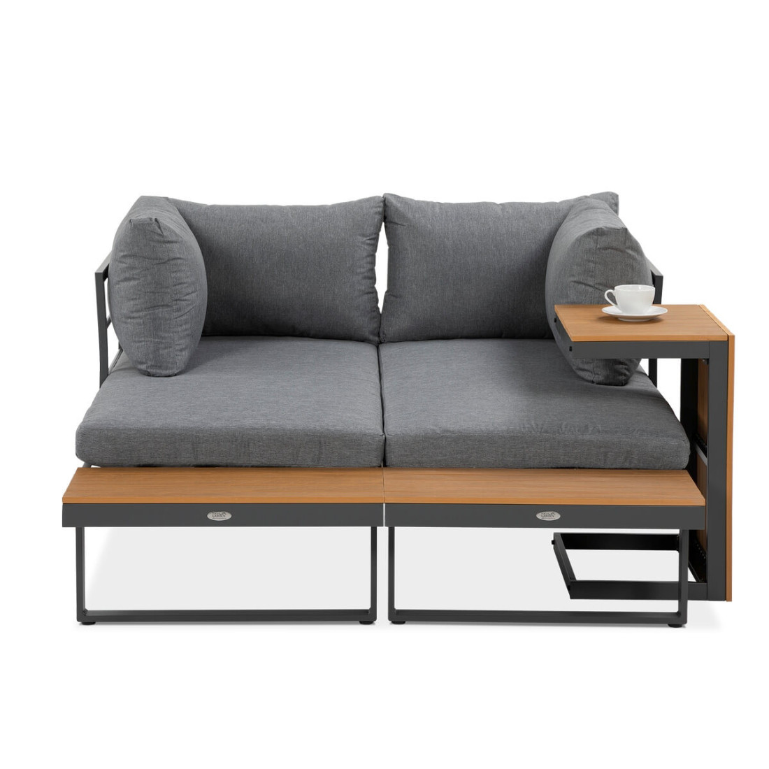 Narożnik modułowy tulip skonfigurowany jako jedna duża kanapa z wysokim stolikiem kawowym obok