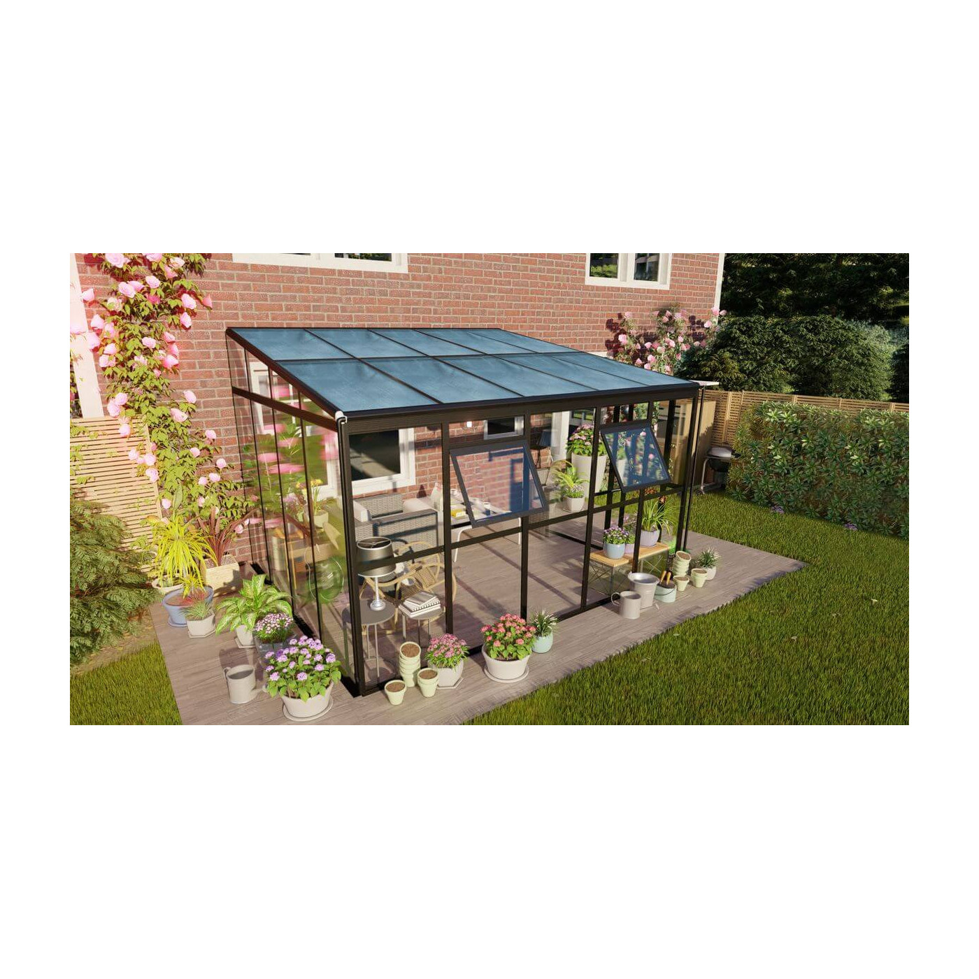 Ogród zimowy SOHO Black 364x290cm PC + Glass - Gutroof aranżacja przy domu wśród roślin i kwiatów, szklana konstrukcja