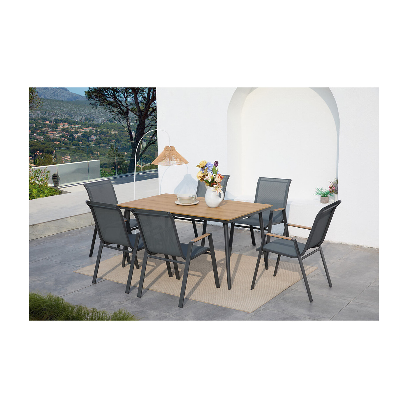 Aranżacja w słoneczny dzień ciemno szarych mebli na ogórd nova dining